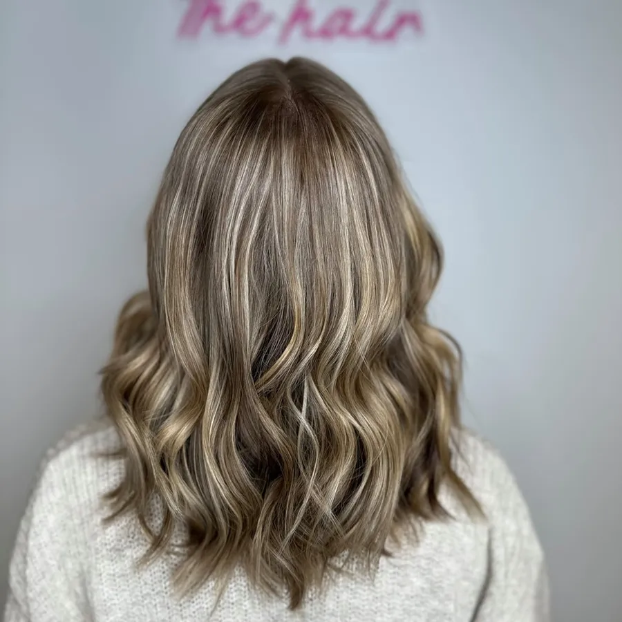 Lived-in blonde balayage with soft waves